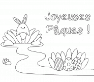 Lapin cherchant des œufs de Pâques dans le jardin - coloriage n° 850